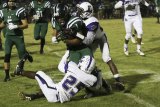 Lemoore's Tahje Tabbs goes for a tackle in the Tigers 21-11 loss to El Diamante Friday night.